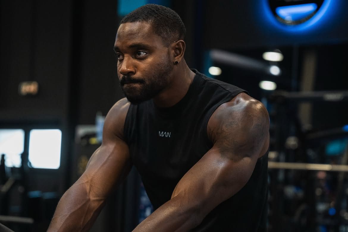 Portrait of Martel Metellus in a black sleeveless top at the gym
